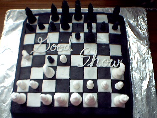 Sugar Whimzy eatable sculpted opening night cake that looks like a chess board - with sculpted pieces