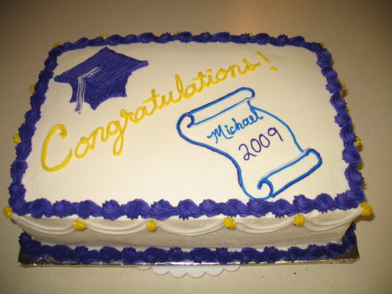 Sugar Whimy graduation cake with hat and diploma frosted onto it