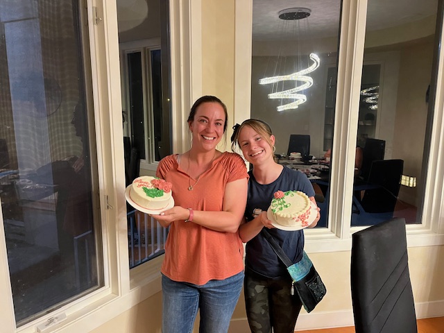 Woman and her daughter with cakes they made themselves